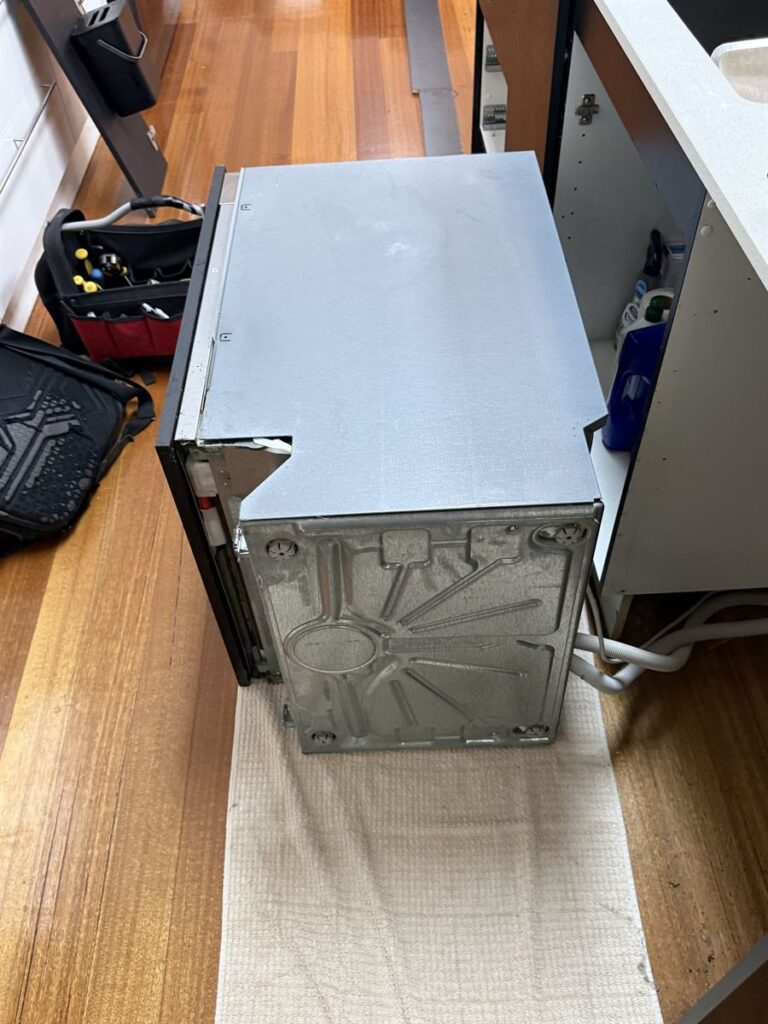 Miele dishwasher removed from the kitchen cabinet so the circulation pump could be reached