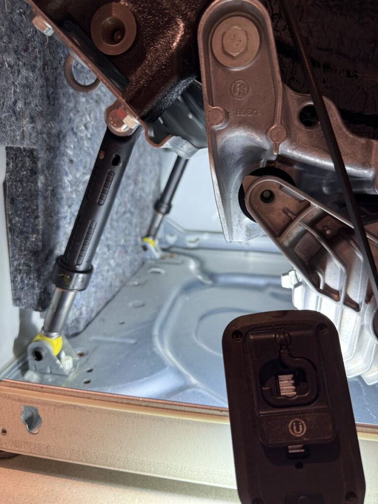 Friction damper mounting inside the base of the Miele washing machine