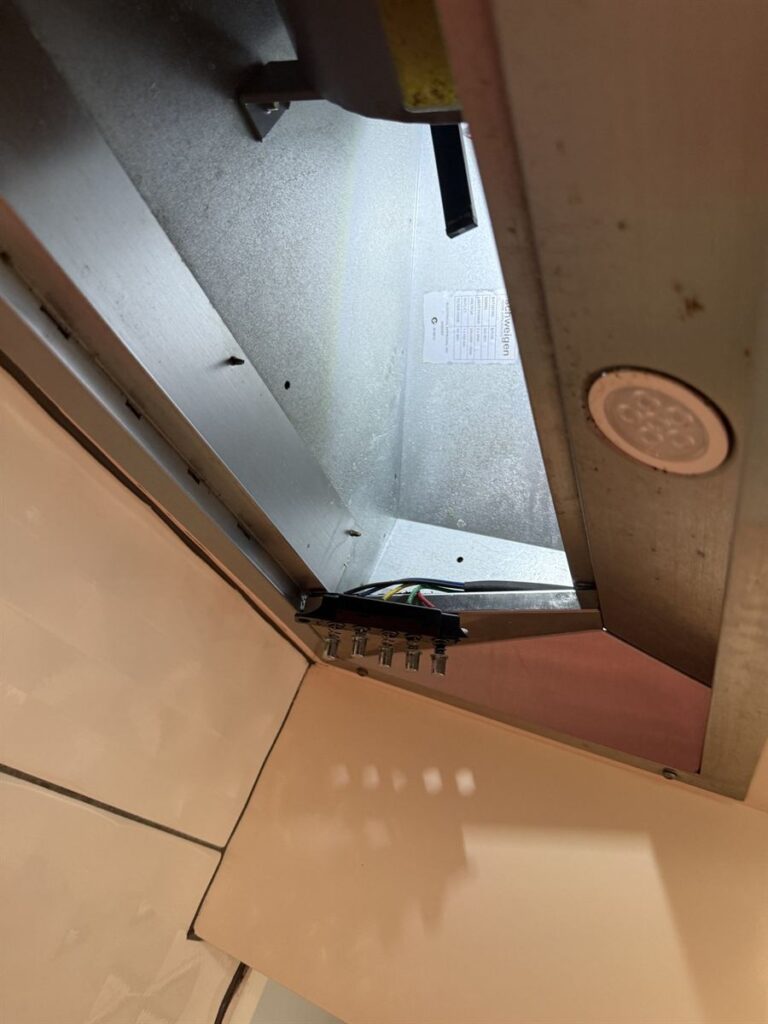 Schweigen rangehood opened up to reach the control switch assembly