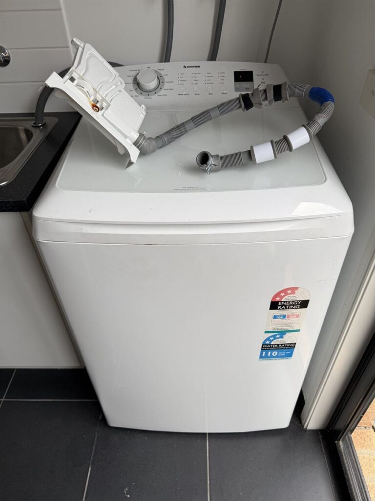 Simpson top loader washing machine in Doreen with the dispenser assembly removed to fix a leak