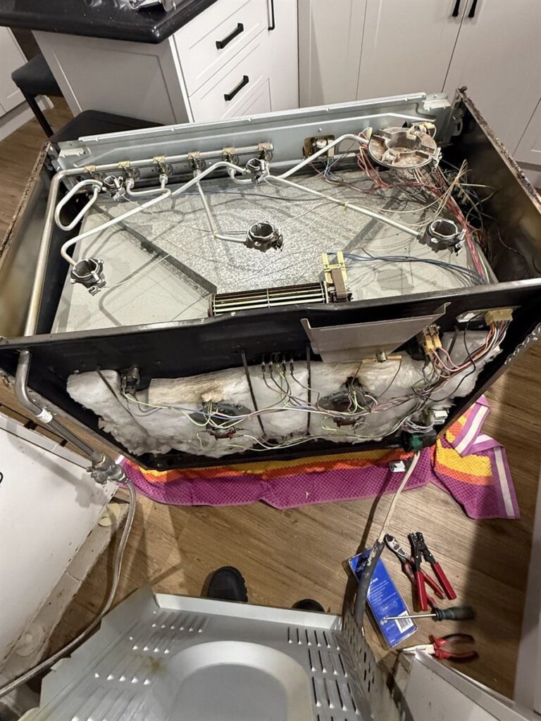 Smeg oven opened up to inspect the internal wiring and components